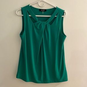 Nine West kelly green blouse with open cut neck line.